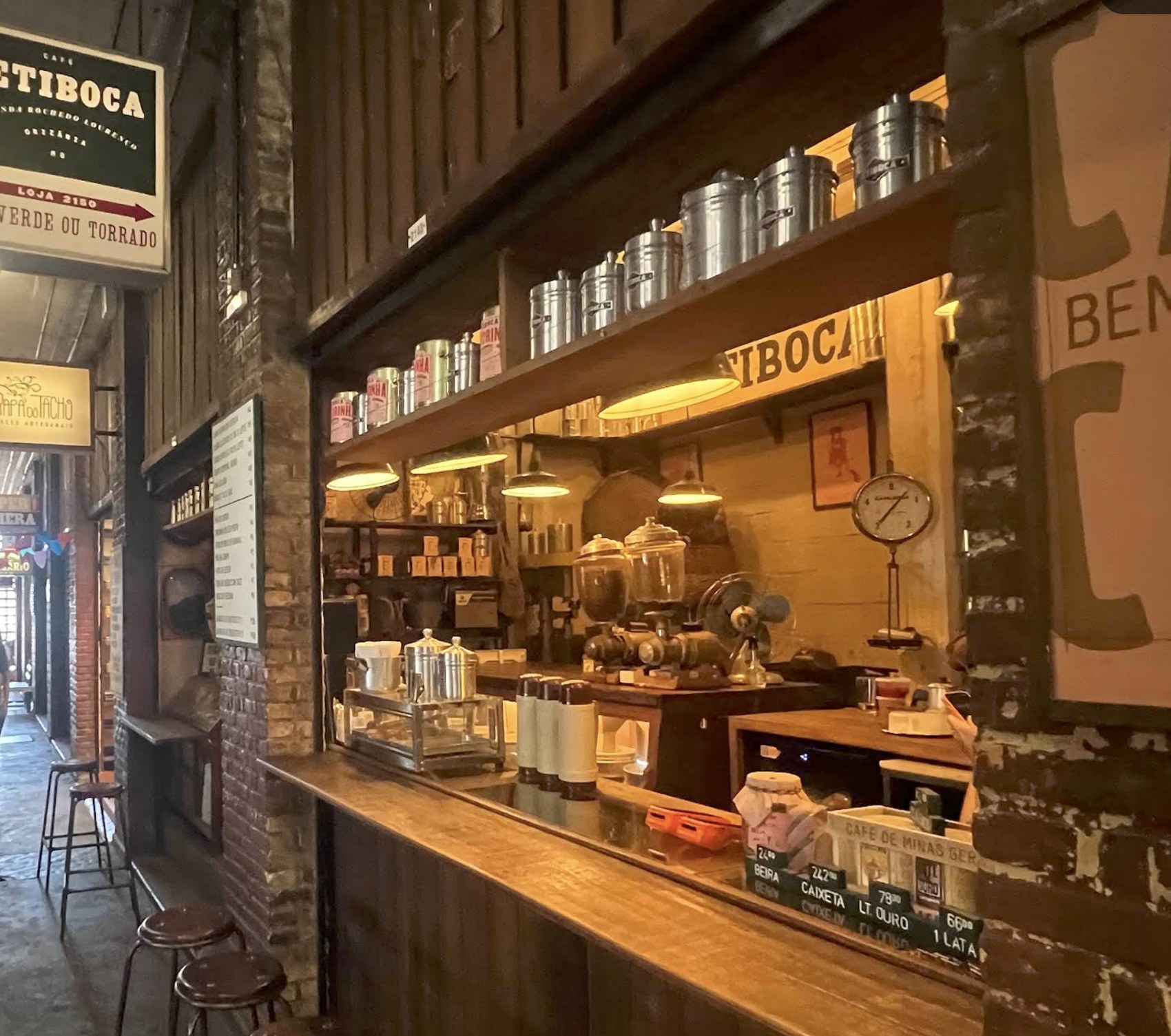 The vintage counter and coffee canisters at Café Jetiboca inside the Mercado Novo